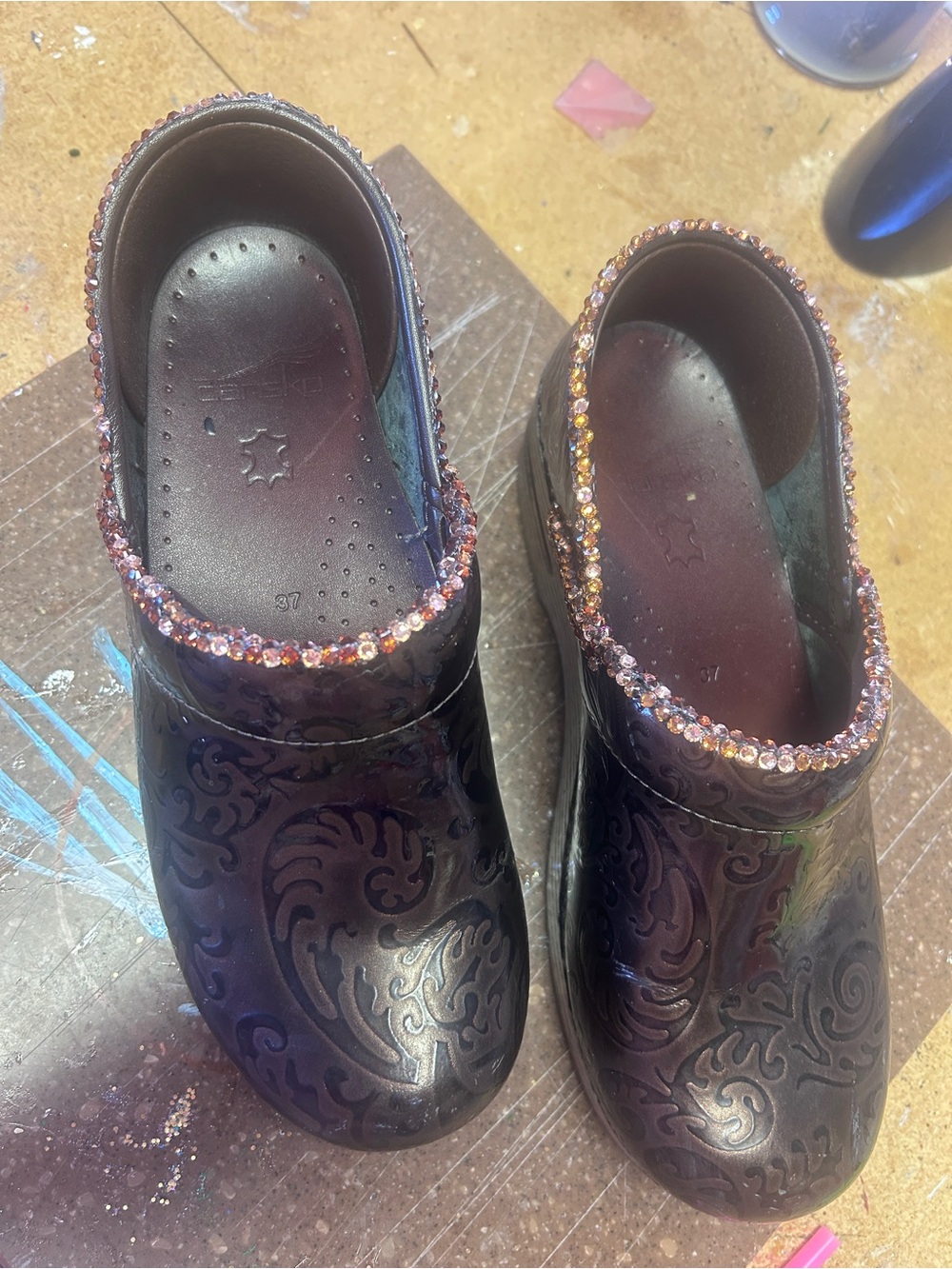 Dansko Brown Embossed Leather Clogs with Assorted Brown Crystal Trim